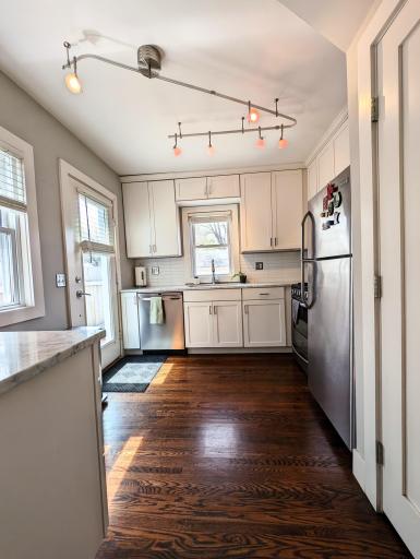 Updated & very functional kitchen with stainless steel appliances including a gas stove