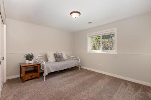 Bedroom number 3 in the lower level offers a comfortable and private space for its occupants. Similar to the other bedrooms, it features ample space and thoughtful design to ensure a restful environment.