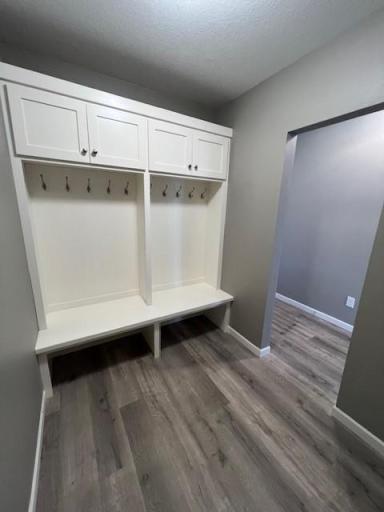 This mud room is conveniently located by the garage door.