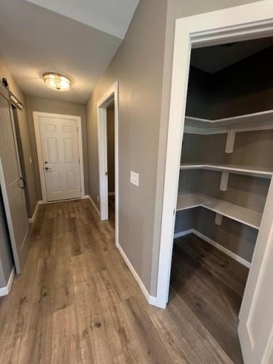 The door leads to garage. The shelving you see is a spacious pantry