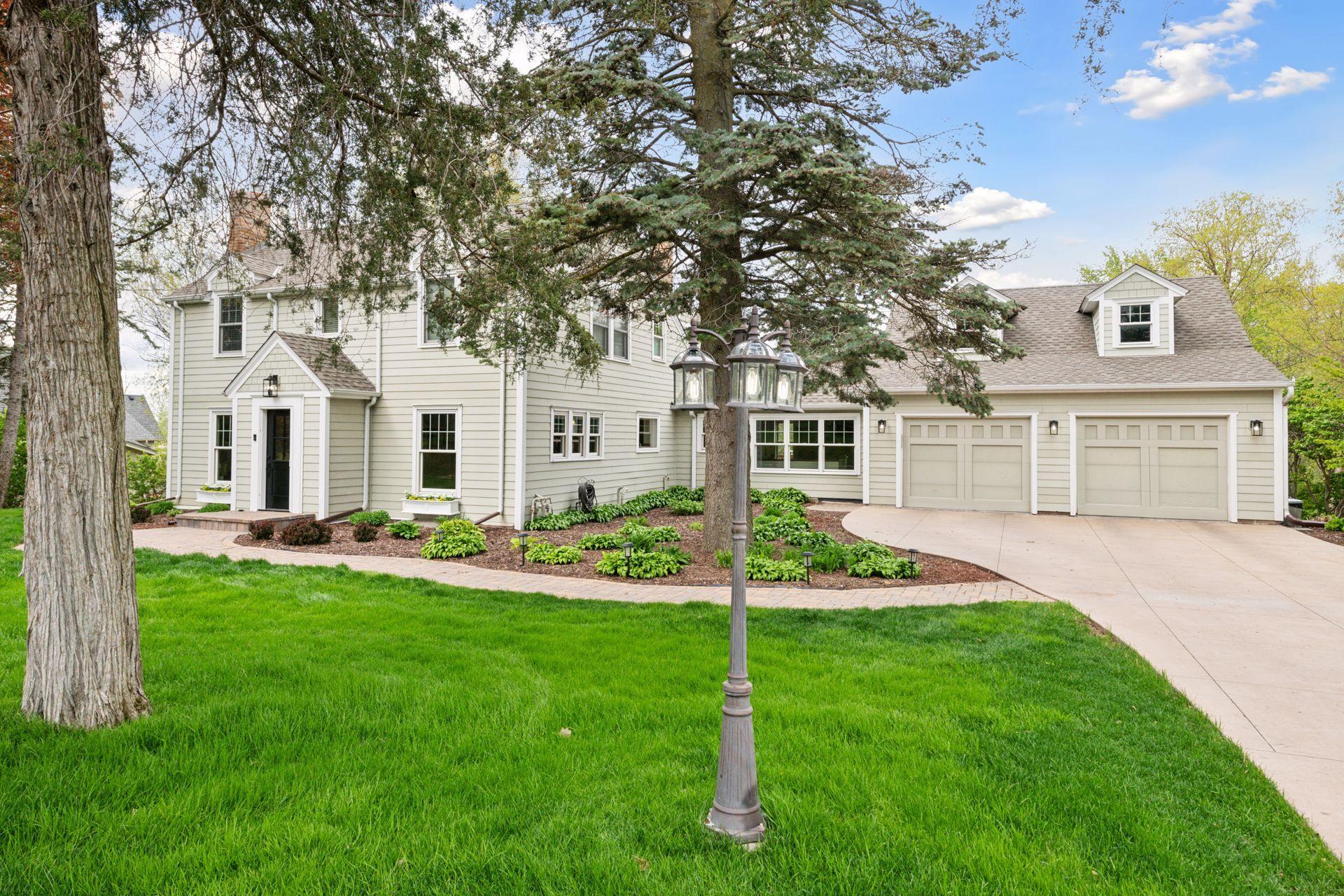Click on our virtual link to for a truly spectacular visual experience. Welcome to this gorgeous renovated home setting on a double lot overlooking a pond across from Grays Bay and located 5 minutes from downtown Wayzata!