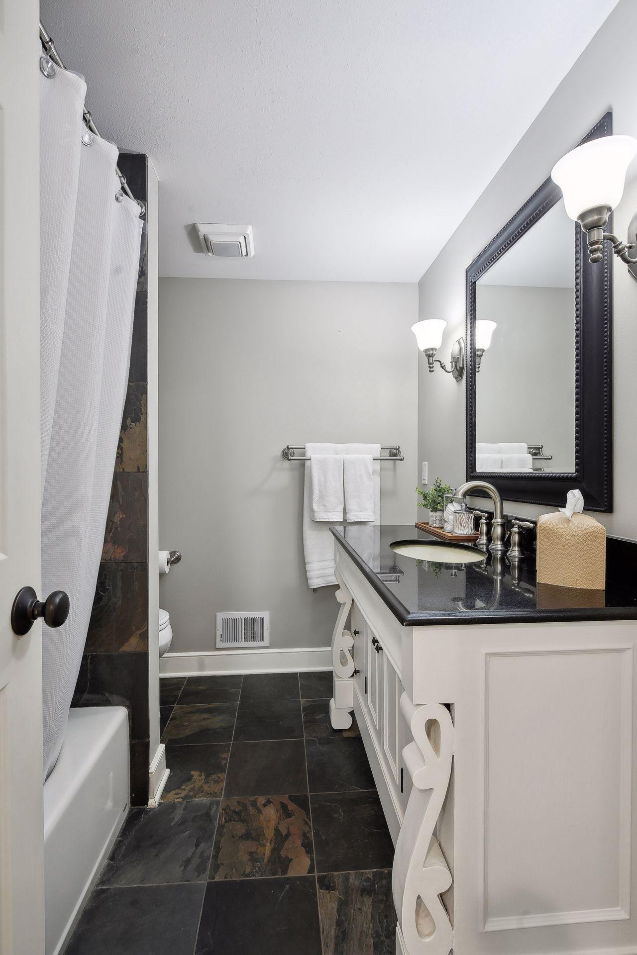Lower level offers a full bathroom.