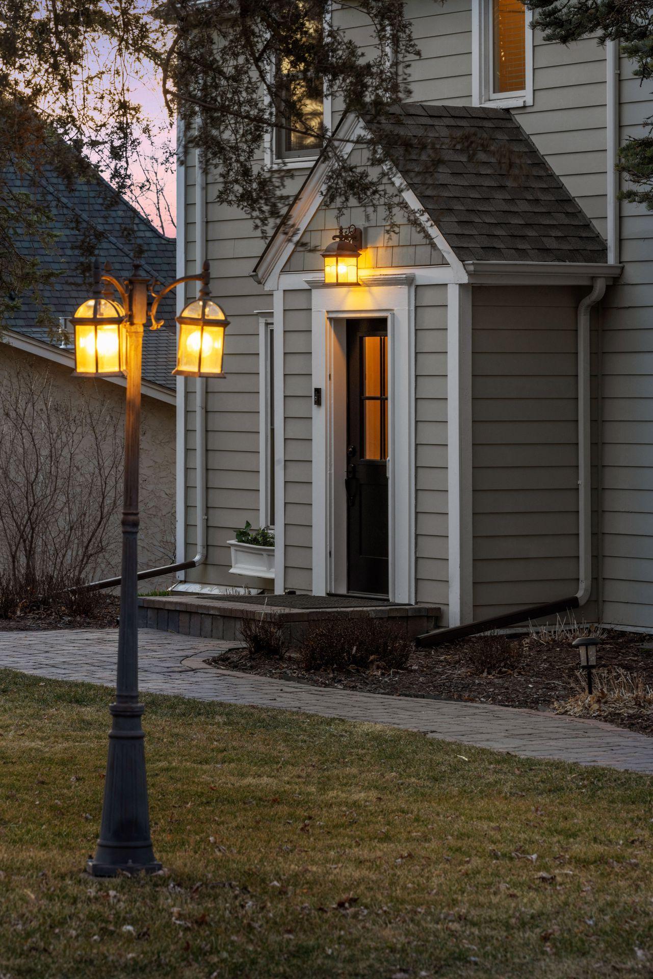The front portico is a fabulous touch - this exterior renovation incorporates all new James J Harding Cement Board Exterior.