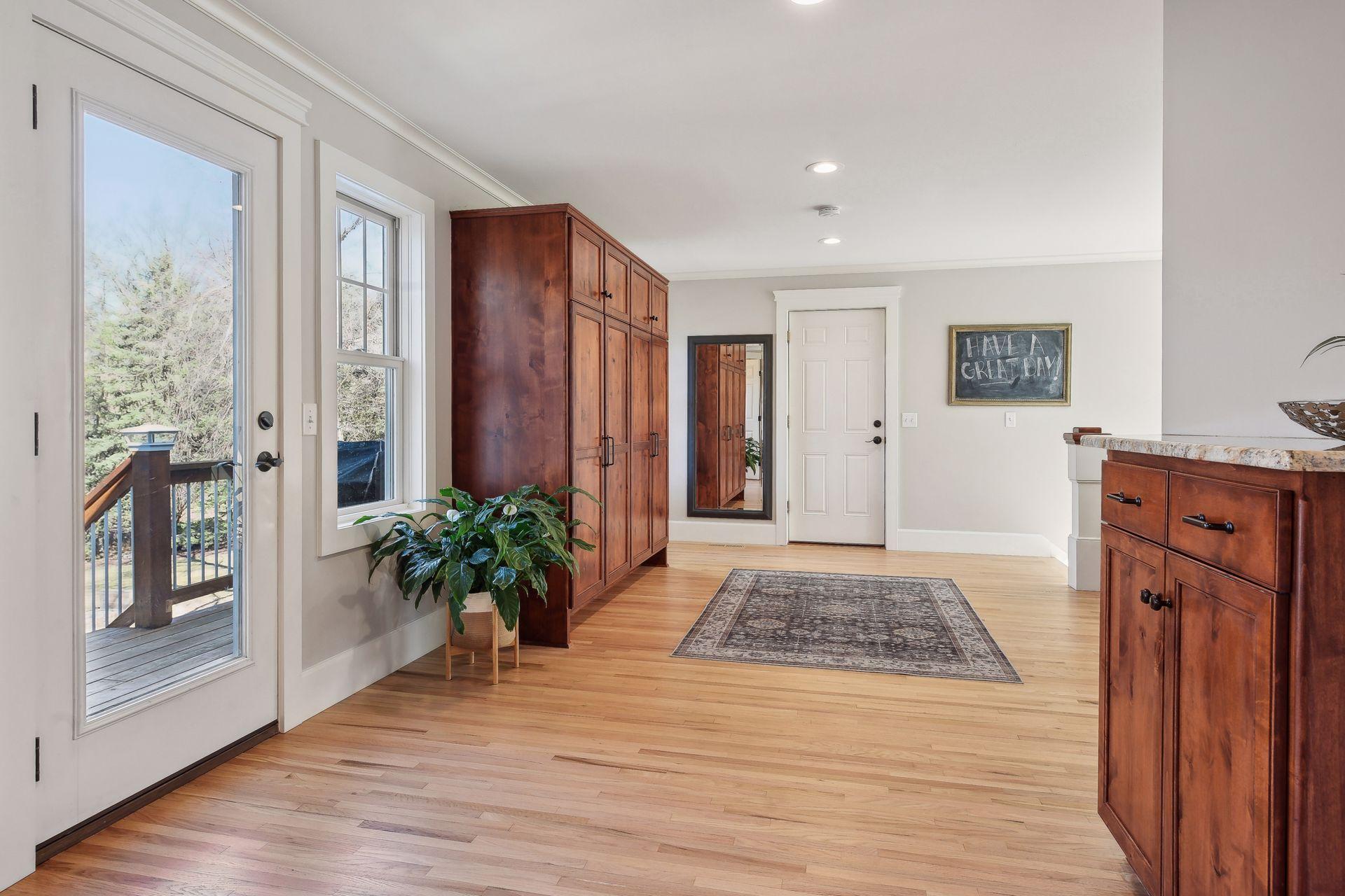 Huge mudroom space greets you off the garage and features built in storage and coat closet.