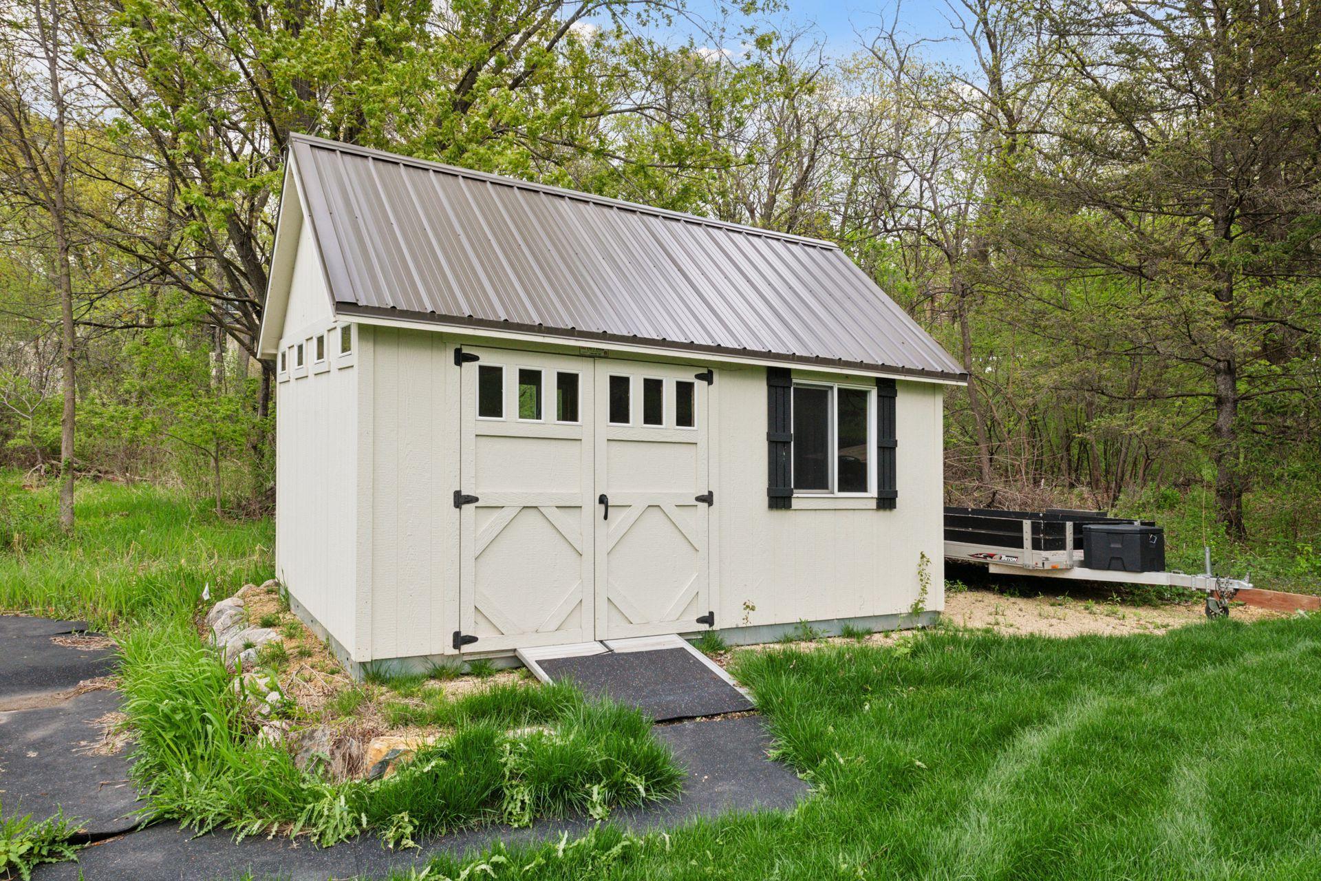 AND yes, this is a perfect spot down by the pond that acts as a garden shed in the summer and a warming house in the winter.