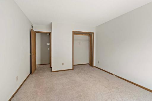 Large walk in closet with primary 3/4 bathroom