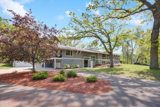 Welcome to 2 Duck Pass Rd! A North Oaks gem nestled on nearly 3 acres of serene landscape.