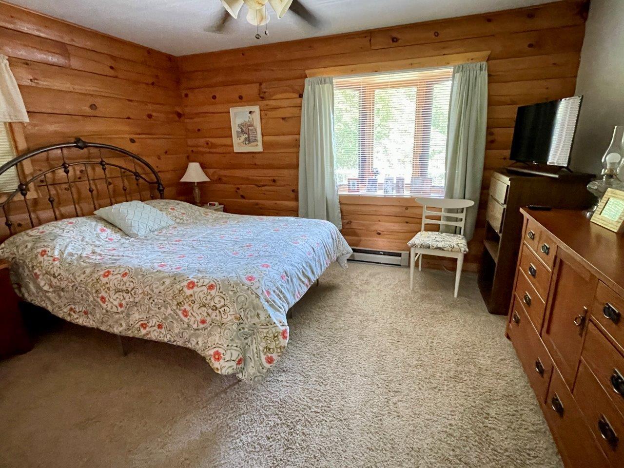 9-Bedroom 1 on main floor with lake view.jpg