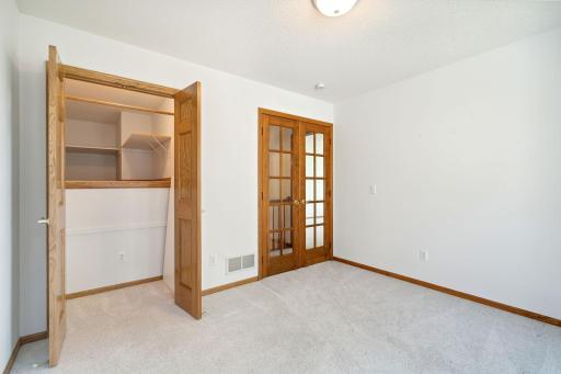 French doors & huge storage in 2nd upper bedroom offer flexibility for uses for this space.