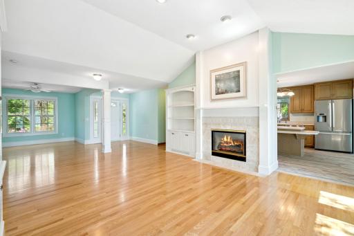 The 2 sided Gas Fireplace is shared with the Kitchen. Beautiful open space includes Dining Room on the left
