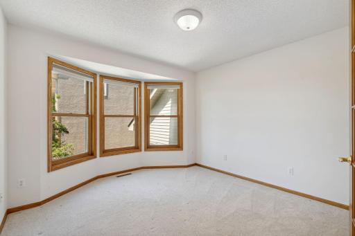 Secondary bedroom with bay windows on the upper level