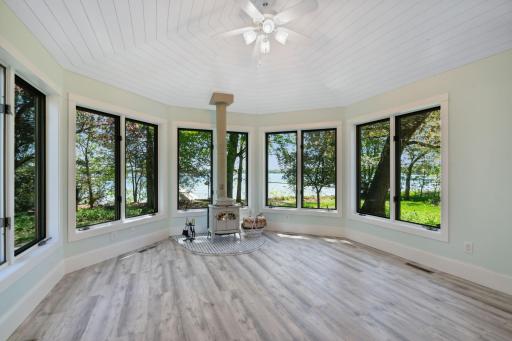 This family room will be a favorite room to enjoy the panoramic lake views & on chilly nights a warm fire.