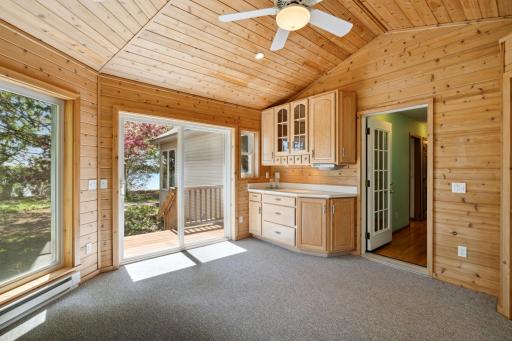 You will never want to leave this beautiful 4 season sunroom with easy access to the lake. Plus convenient serving cabinets & also a closet (not seen in photo)