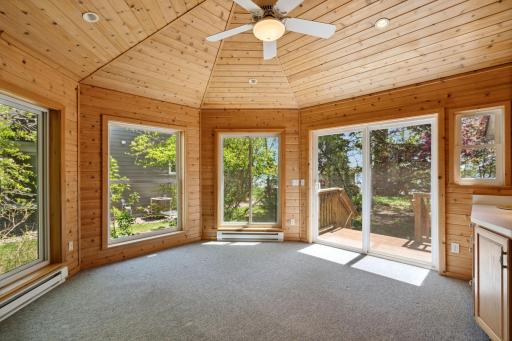 Views & sunlight & another unique & grand vaulted ceiling!