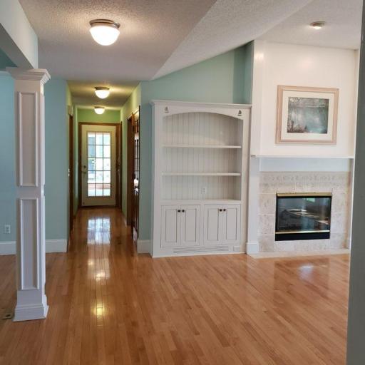 Hallway leads to the impressive Sunroom. The main floor Bath, Sauna, & Laundry room are on the left side of the hall.