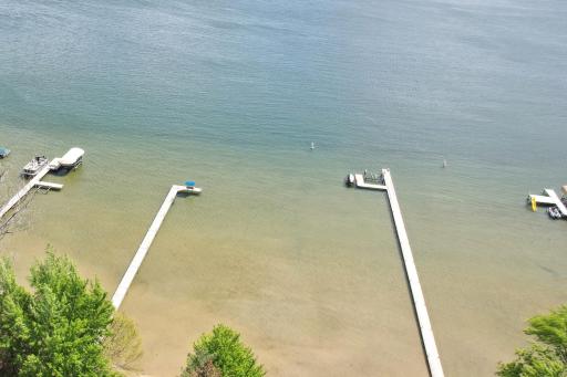 100' of Prime lakeshore on the coveted north side of Turtle Lake. The dock for this property includes the bench with the blue canopy.