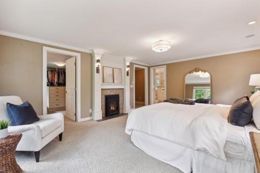 Gas fireplace, large walk-in closet and private bath with tub, shower and matching vanities