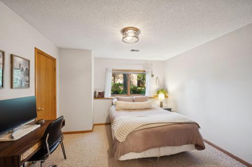You will love this fourth bedroom. Large walk in closet. Queen bed and desk and still feels spacious.