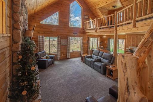 The Great Room features vaulted ceilings and a wall of windows (floor to ceiling) that really bring the outdoors inside!