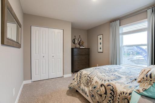 Another view of this spacious bedroom. Photos shown of same floorplan, see sales agent for details on color selections.