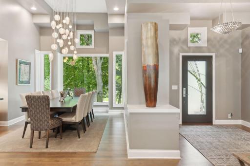 Spectacular Dining room offers, soaring ceilings, massive windows flood the home with natural light
