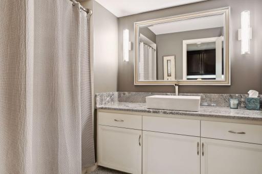 Full bathroom with granite tops and designer sinks