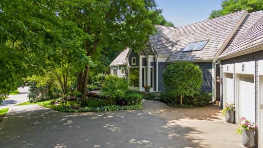Driveway and courtyard view with professional landscaping