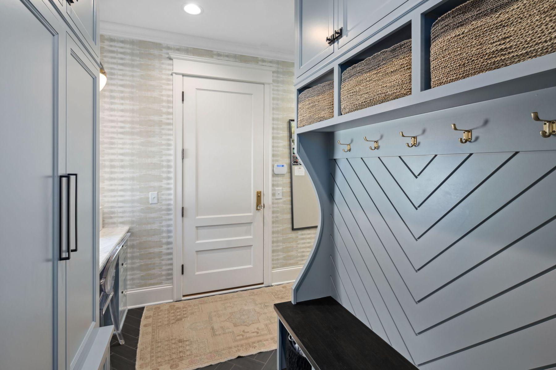 Mudroom with large seasonal closer and lockers.