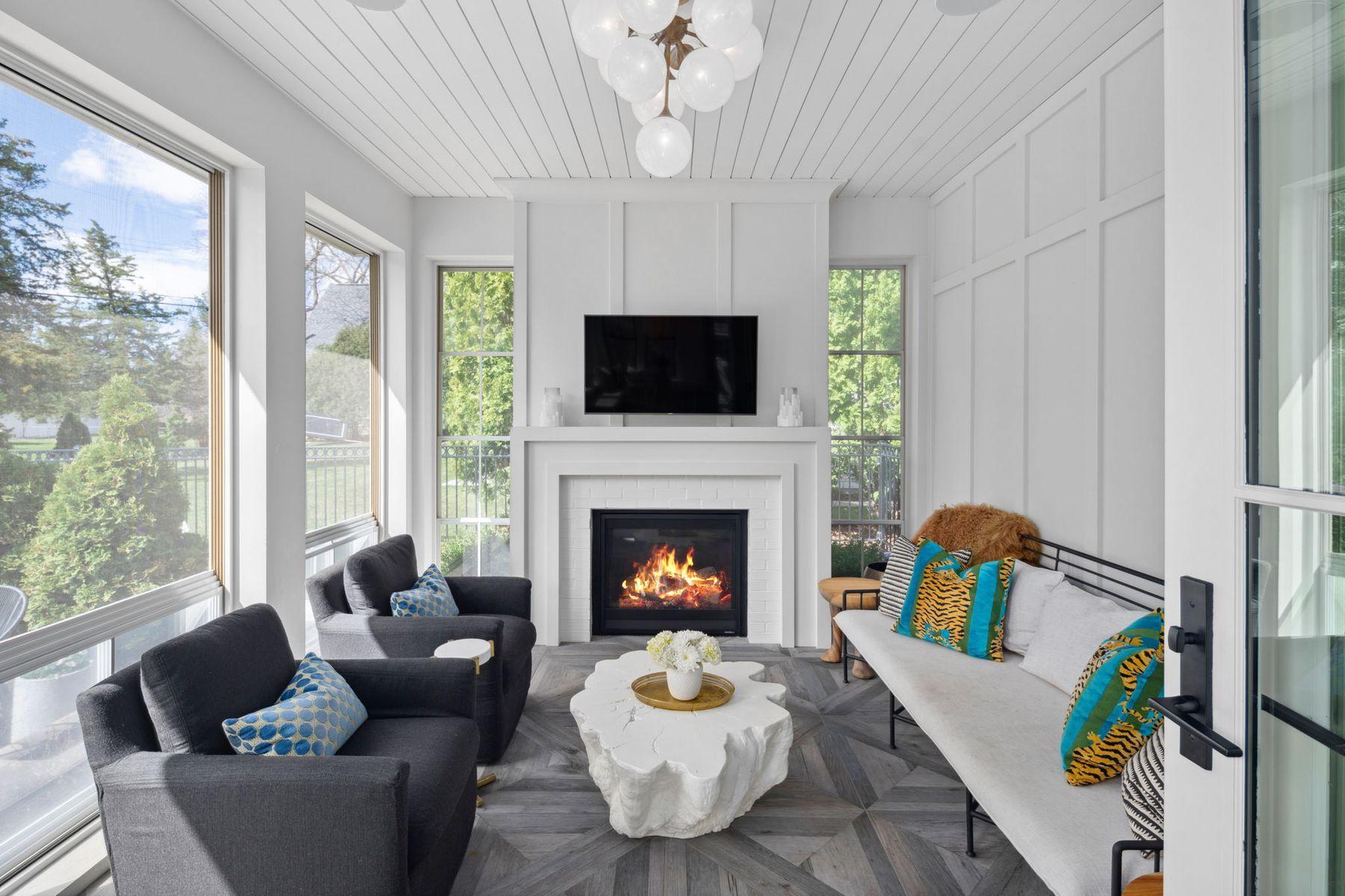 All season porch with heated floors, gas fireplace and EZ Screens.