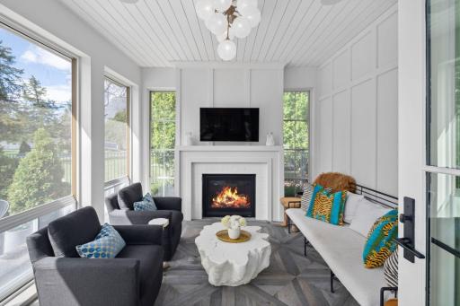 All season porch with heated floors, gas fireplace and EZ Screens.