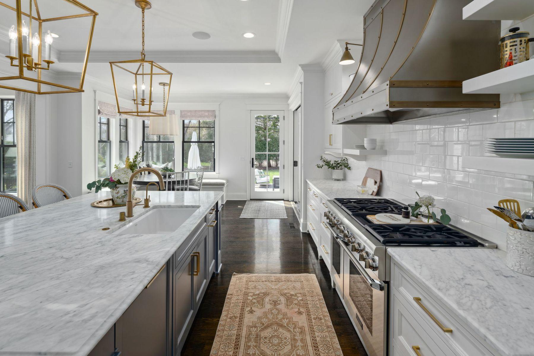 Stainless hood with brass strapping.