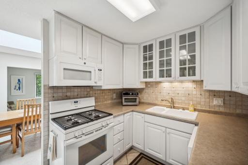 Beautiful white cabinets and newer appliances.