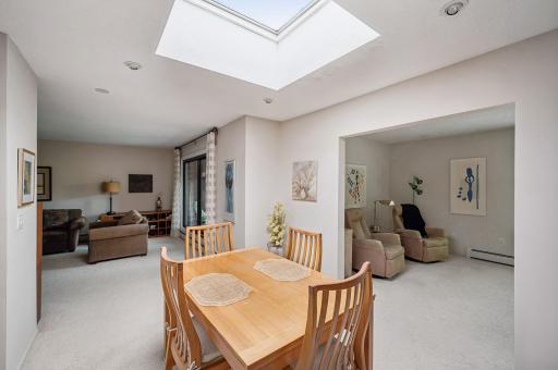 Don't forget to look up! Lovely skylight for natural sunlight filtering into this corner unit.