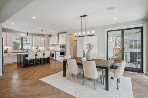 Photo for 3722 Woodland Cove Parkway, Minnetrista, MN 55331 - Listing #6533987 Seamlessly flowing from the kitchen is an adjacent informal dining space, perfect for hosting gatherings and entertaining guests.