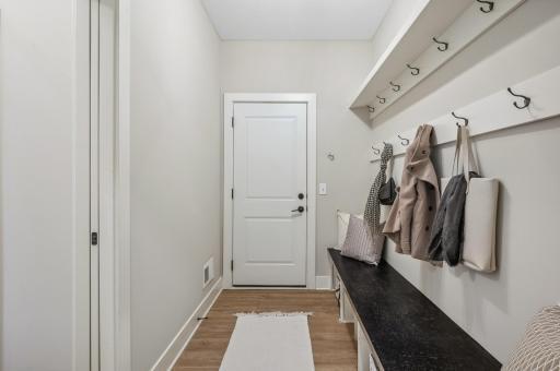 Photo for 3722 Woodland Cove Parkway, Minnetrista, MN 55331 - Listing #6533987 Large mudroom with built-in bench and hooks offers convenient access to the attached 3+ car garage.