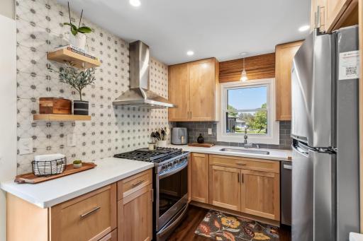 You will love the feel of this functional and updated kitchen, around the corner is a large pantry/Ikea brand that the Sellers are leaving with the home which gives you even more storage space.