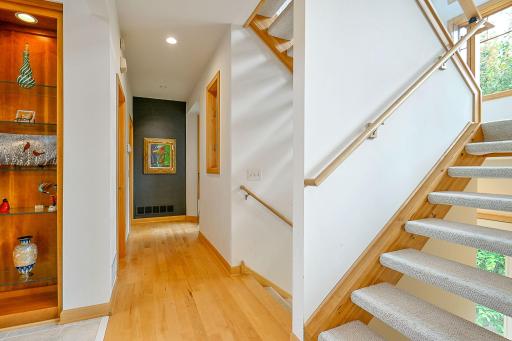 looking down the hall toward the primary bedroom on the main level