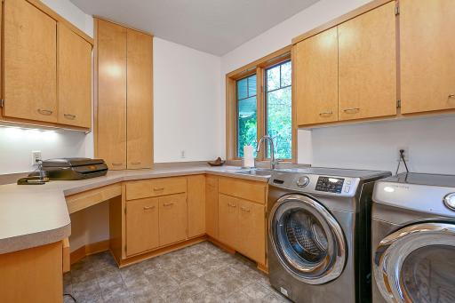 main level laundry room with Samsung washer/dryer