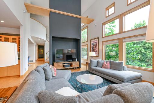 soaring ceilings enhance enjoyment of the mature landscape in every season