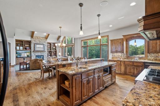 The expansive main level features an open floor plan with a gourmet kitchen.