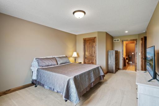 Upper level guest bedroom that shares a Jack and Jill bath