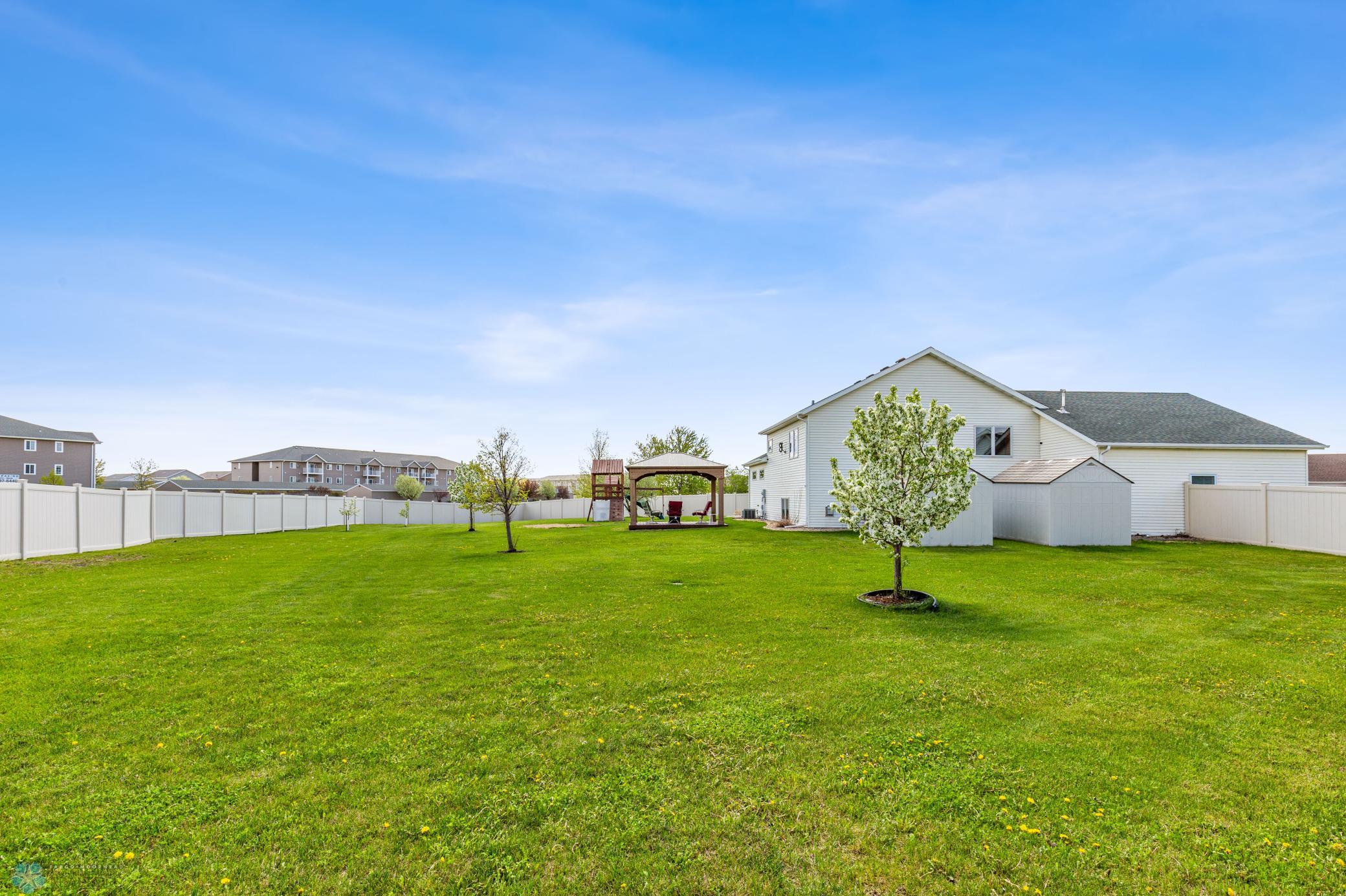 Nice size yard for entertaining. A couple of fruit tress, sprinkler system and storage (2) sheds .