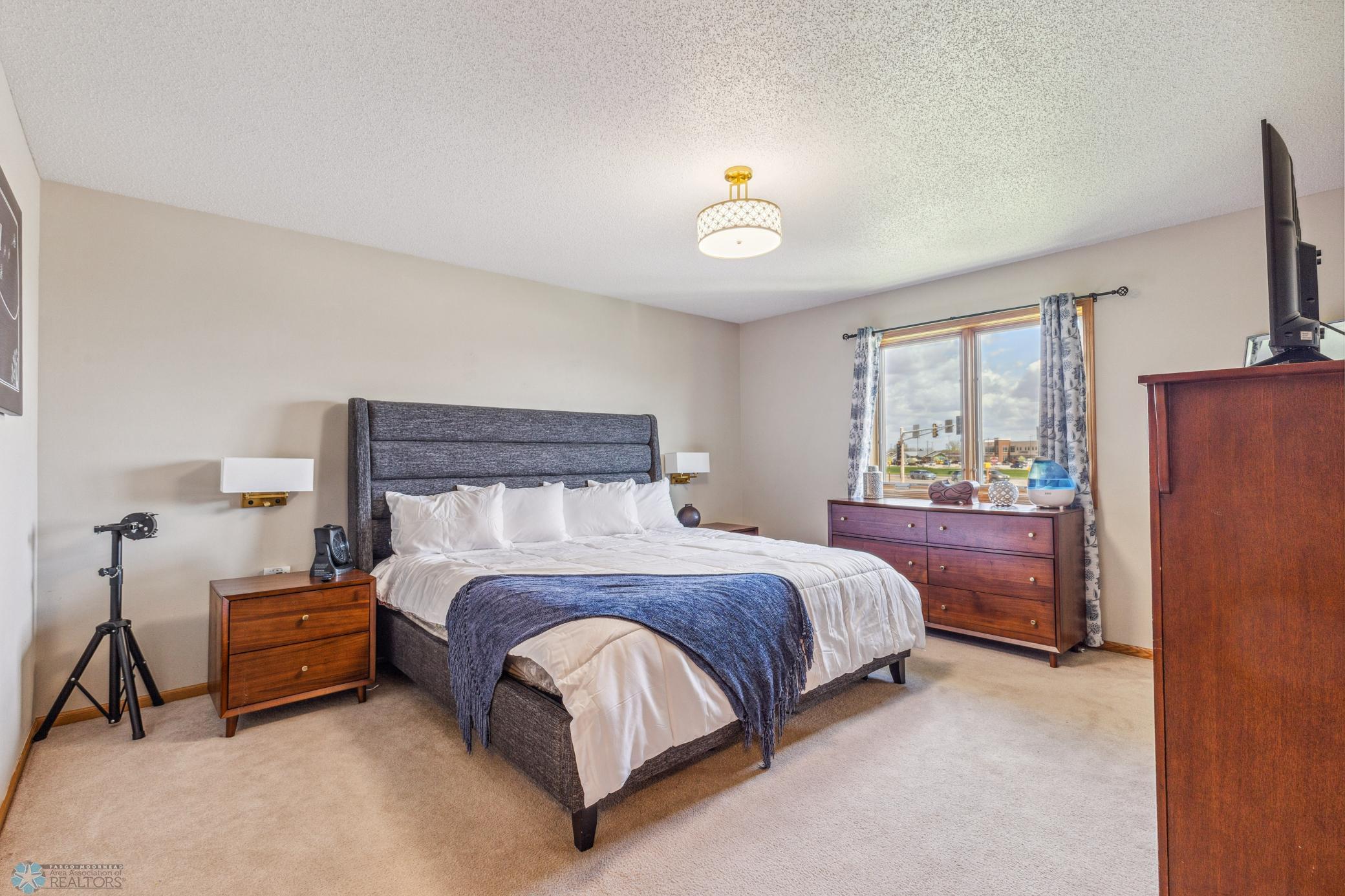 Primary Bedroom, upper level with a full bath and walk in closet.