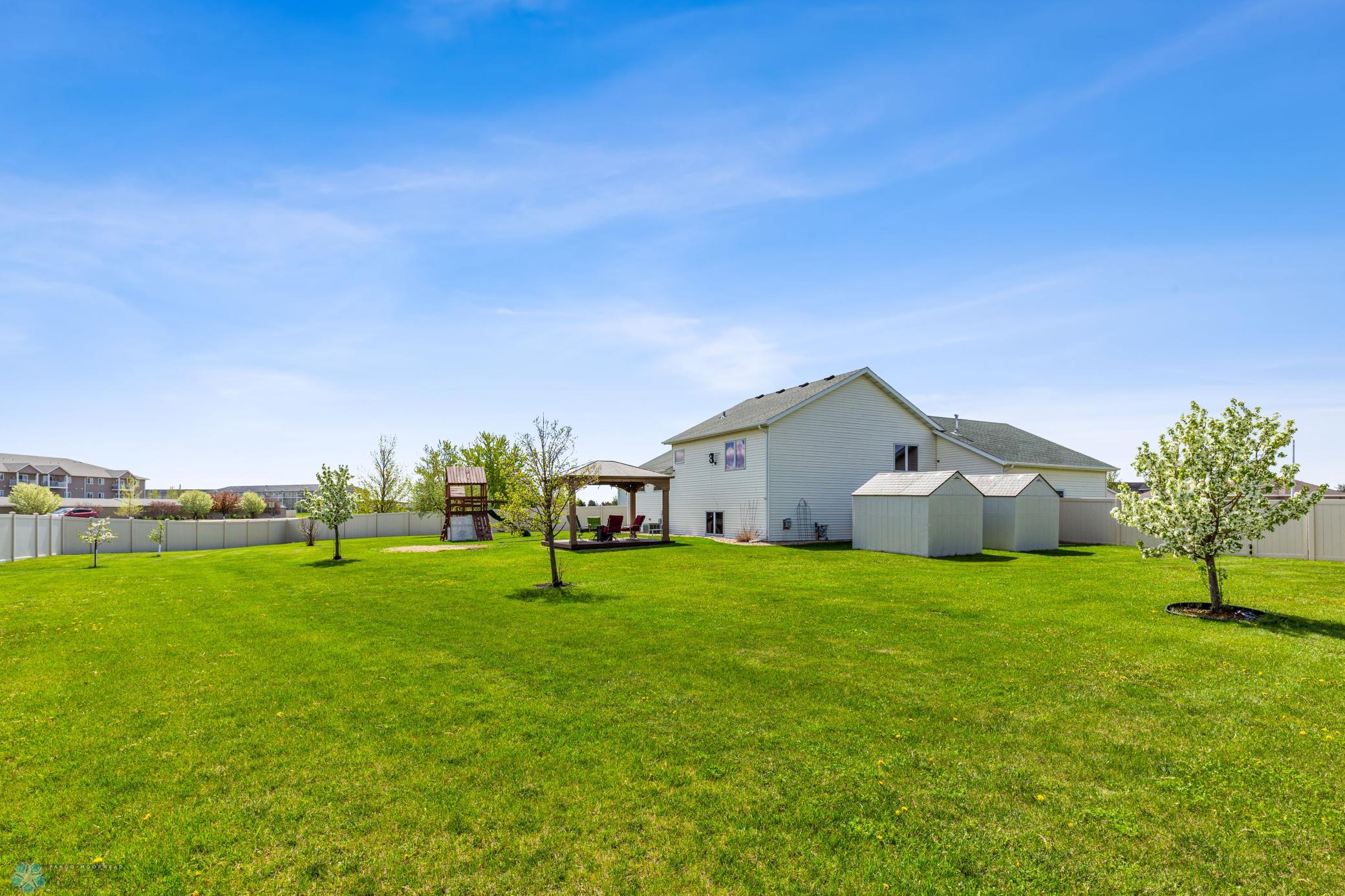 Back yard with gazebo (included).