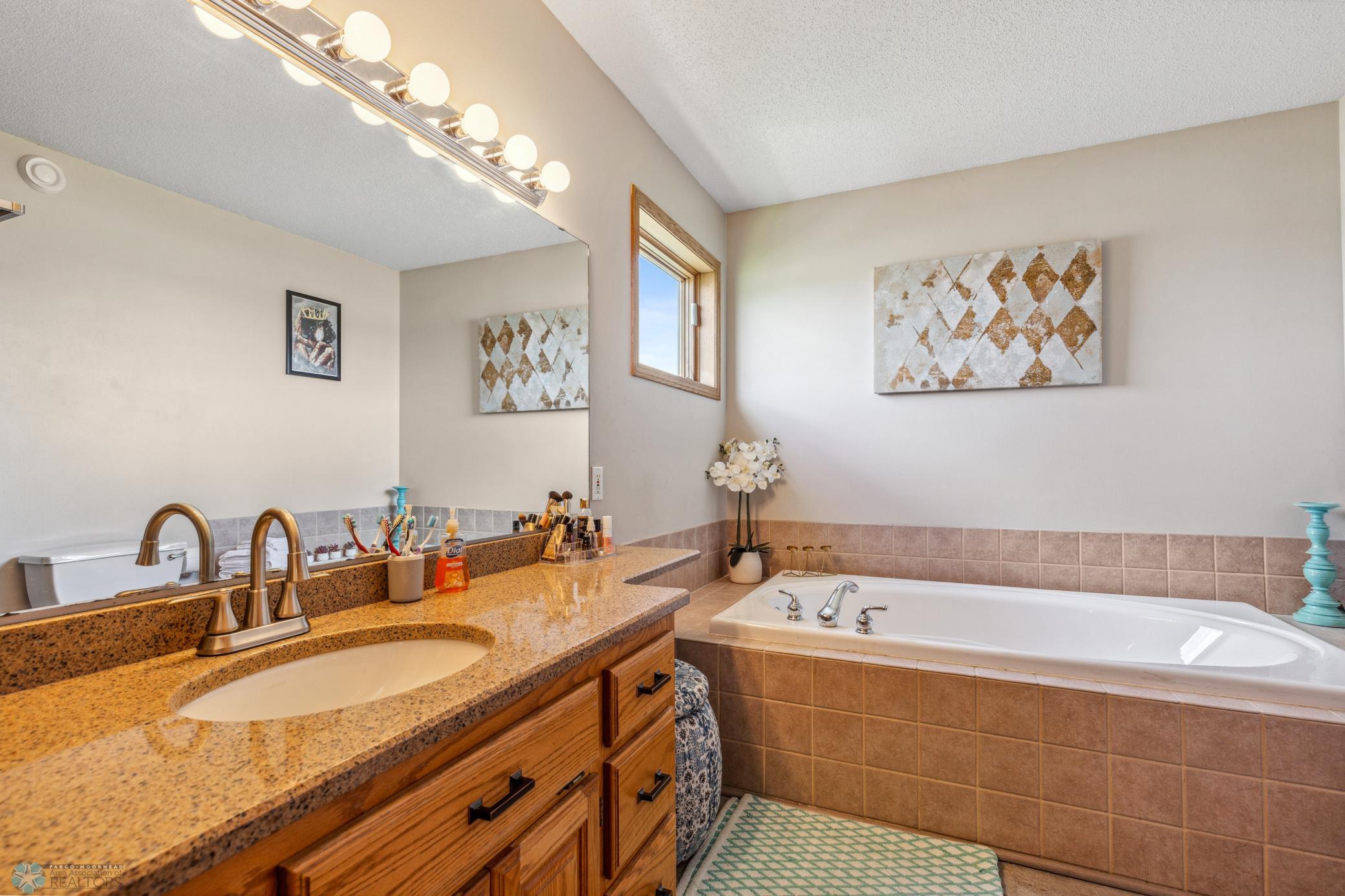 Primary Full Bath with a jetted tub.