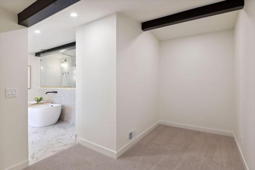 Walk In Primary Closet. Renderings show current plans for closet. Buyer to receive credit towards build out. Buyer can also choose to customize if they prefer a different configuration and layout.