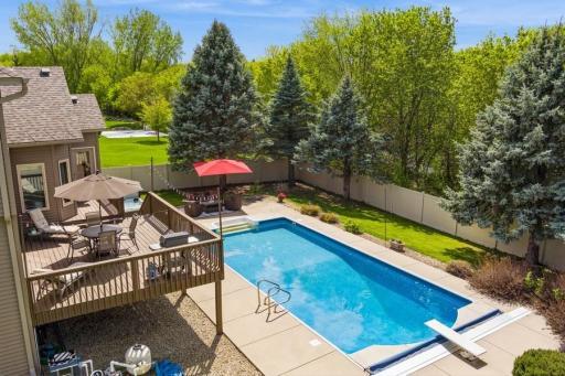 Refreshing below ground pool with diving board (Roman End) and maint-free fully fenced backyard