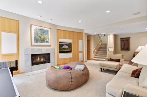 Gas burning fireplace, luxurious carpet and warm wood accents