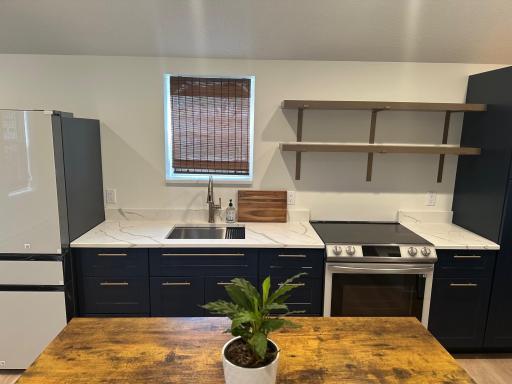 Kitchen features all new cabinets & appliances
