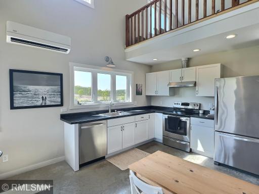 Get lost in a good recipe, the kitchen is complete with stainless steel and a window with views!